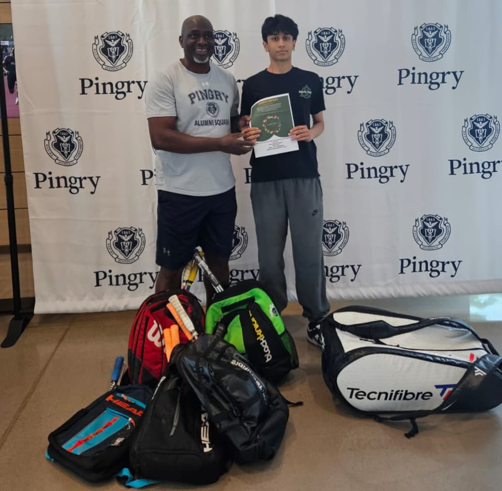 Sports Trinity volunteers with sports equipment collected at a donation drive
