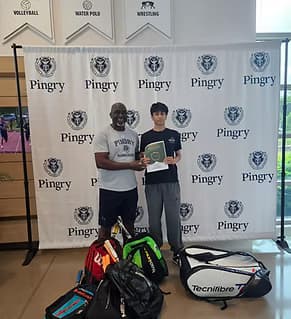 Young athletes in Nigeria with squash equipment donated by Sports Trinity